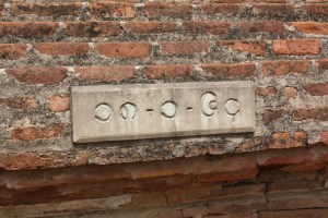 I struggle with Burmese, but I believe this says, "Take off your shoes."